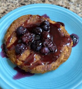 Homemade mixed berry syrup made with fresh berries, served as a topping for pancakes.