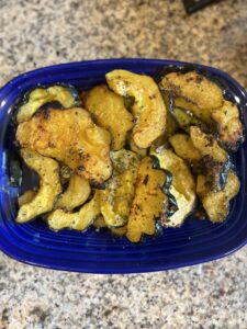 Parmesan-crusted acorn squash slices roasted with fresh herbs and Parmesan cheese until golden brown