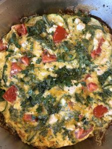 frittata with zucchini, tomatoes and garlic scapes